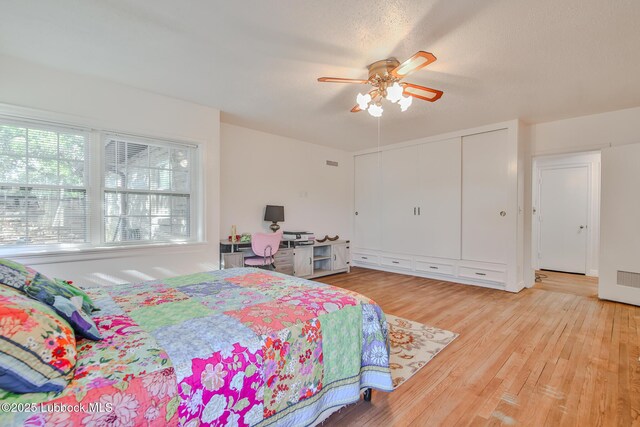 1901 31st St, Lubbock, TX 79411 - bedroom with light wood finished floors, a closet, and ceiling fan