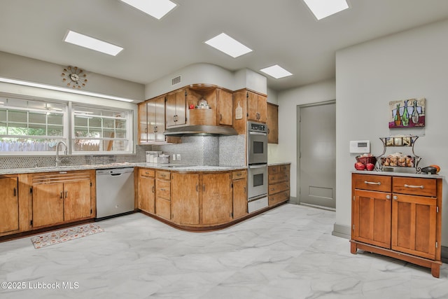 1901 31st St, Lubbock, TX 79411 - kitchen featuring appliances with stainless steel finishes, light marble finish flooring, a sink, and tasteful backsplash