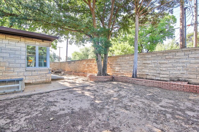 1901 31st St, Lubbock, TX 79411 - fenced backyard featuring a patio area