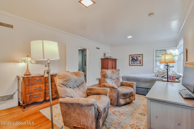 1901 31st St, Lubbock, TX 79411 - living room with crown molding and light wood finished floors