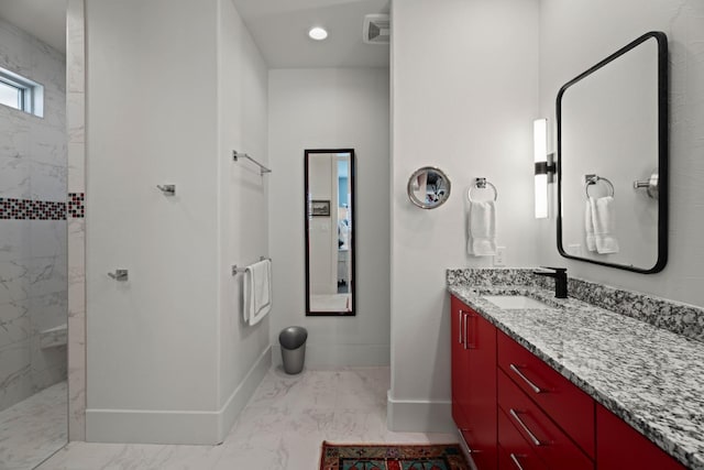 full bathroom with marble finish floor, recessed lighting, vanity, baseboards, and walk in shower