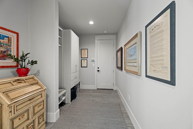 corridor featuring recessed lighting and baseboards