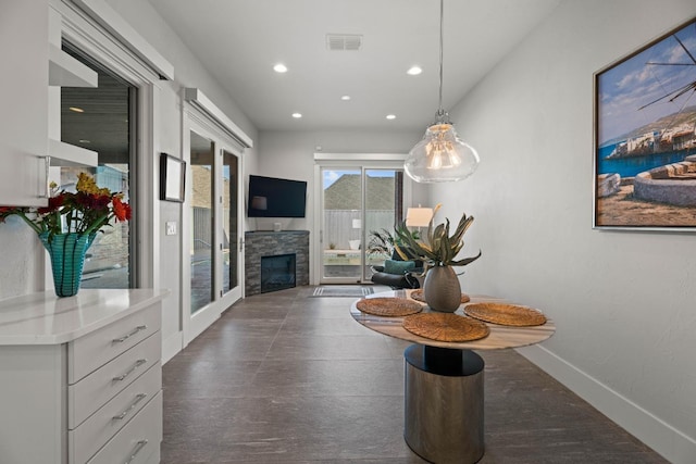 corridor with recessed lighting, visible vents, and baseboards