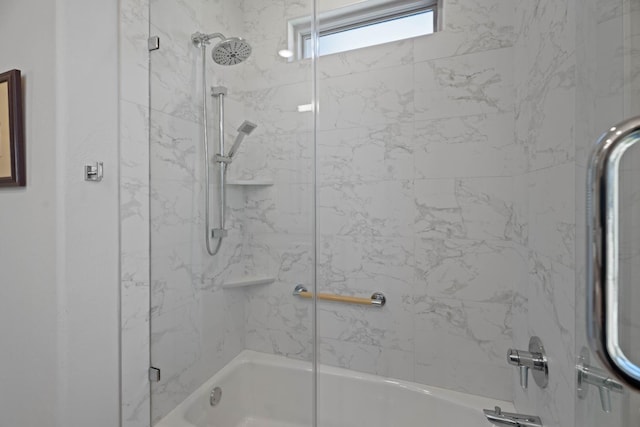 bathroom featuring bath / shower combo with glass door