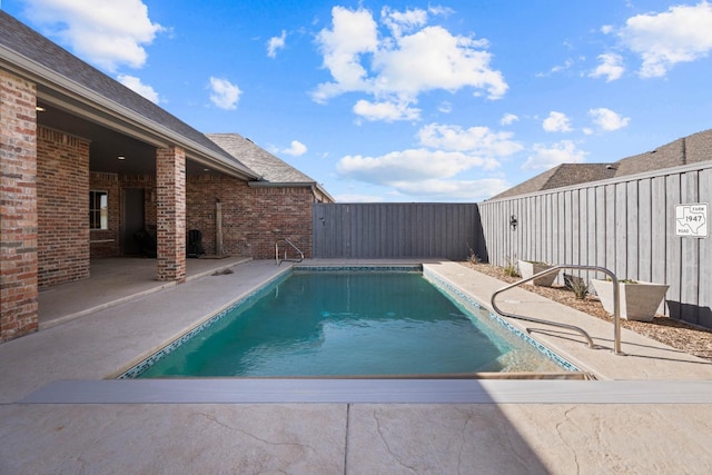 view of pool with a patio area, a fenced backyard, and a fenced in pool