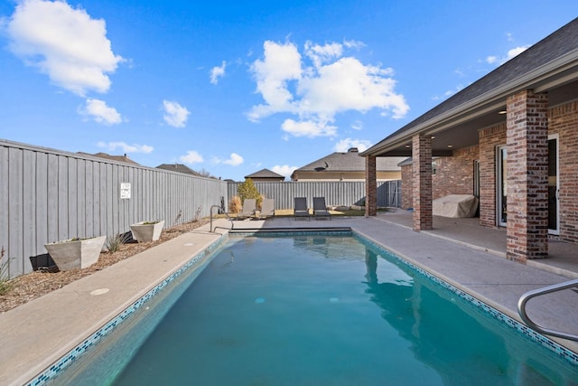 view of pool with a patio area, a fenced backyard, and a fenced in pool