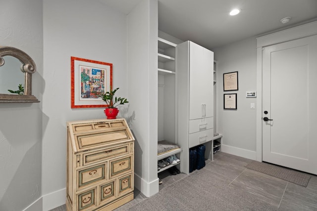 mudroom with baseboards and recessed lighting