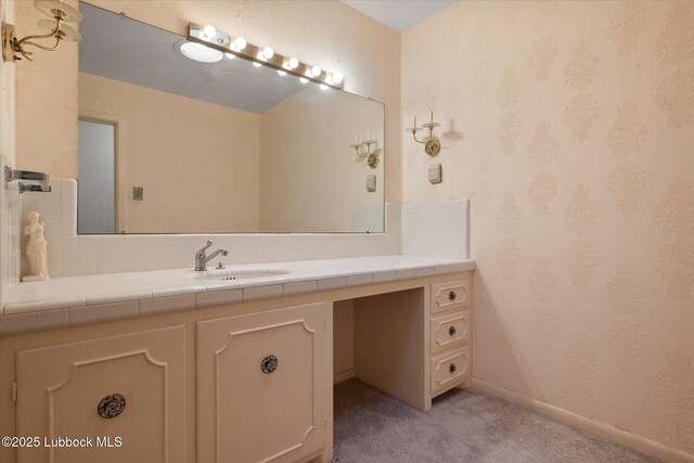 5426 28th St, Lubbock, TX 79407 - bathroom featuring vanity and tasteful backsplash
