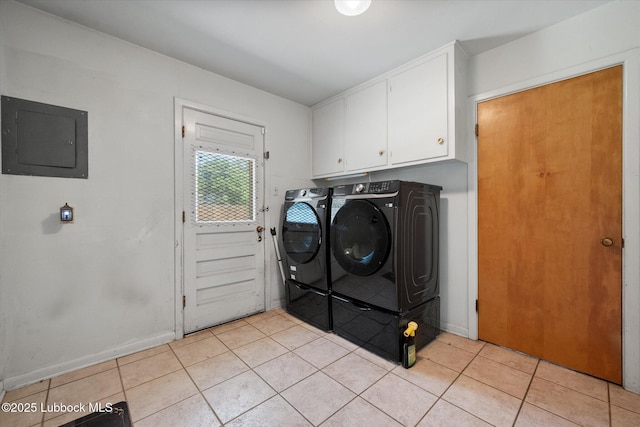 5426 28th St, Lubbock, TX 79407 - laundry room featuring electric panel, independent washer and dryer, light tile patterned floors, and cabinet space