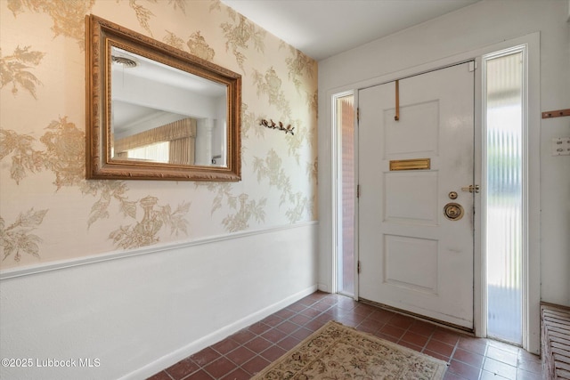 5426 28th St, Lubbock, TX 79407 - entrance foyer featuring dark tile patterned flooring and wallpapered walls