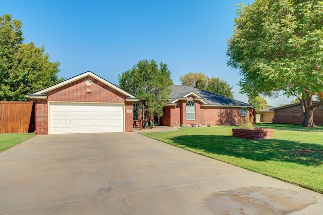 ranch-style house with a garage and a front lawn