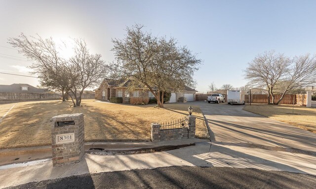 8301 County Rd 6950, Lubbock, TX 79407 - view of front facade featuring brick siding and a chimney