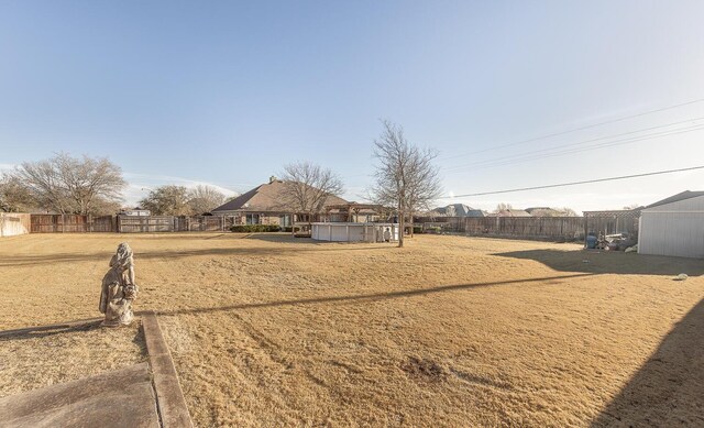 8301 County Rd 6950, Lubbock, TX 79407 - back of property featuring a fenced backyard