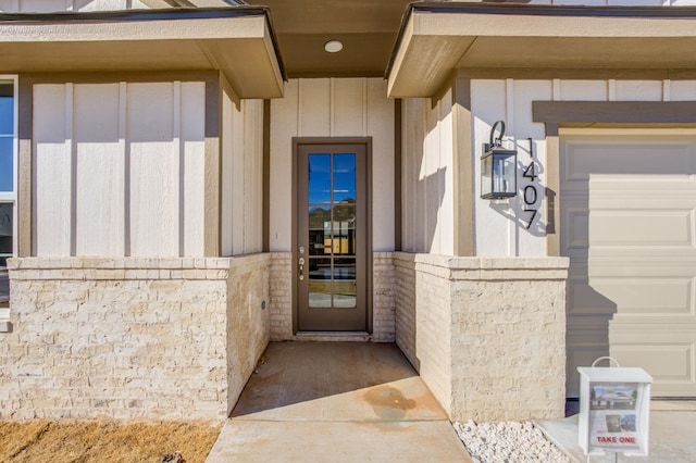 doorway to property featuring a garage