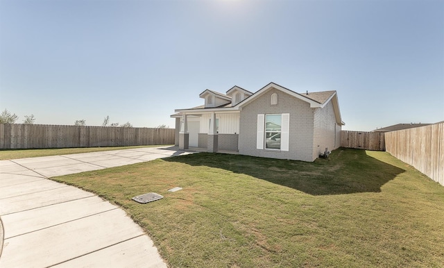 view of front of property featuring a garage and a front yard