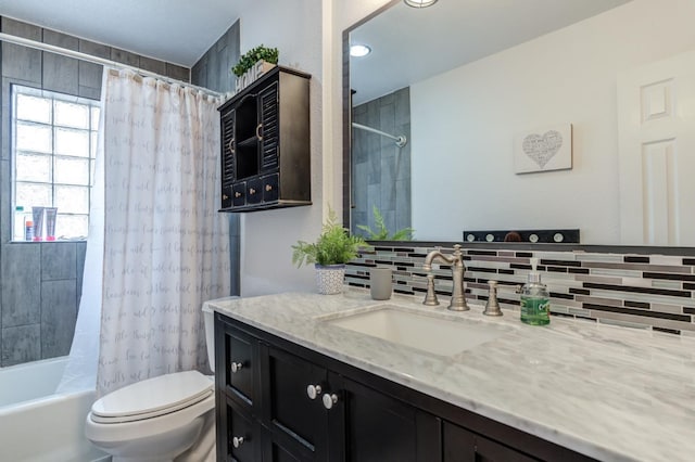 full bathroom with vanity, toilet, shower / tub combo, and backsplash