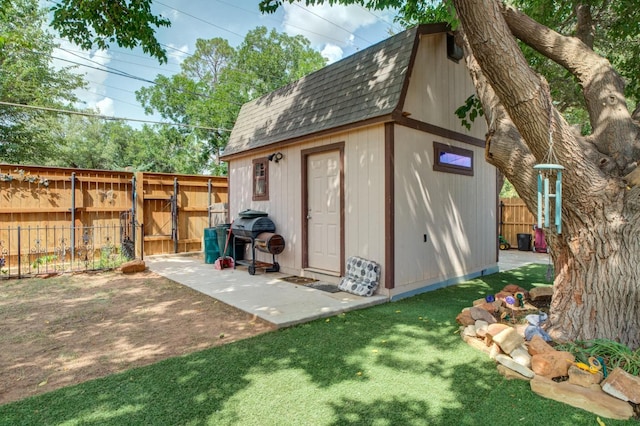 view of outdoor structure with a lawn