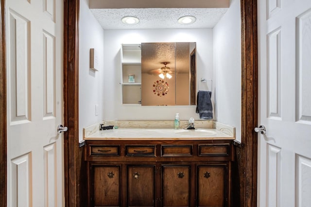 bathroom with vanity and a textured ceiling