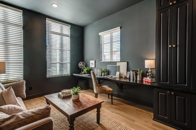 office with light wood-type flooring