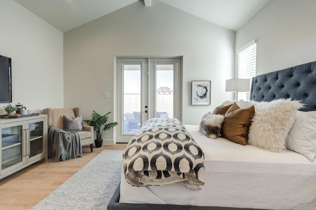 bedroom with french doors, lofted ceiling, light hardwood / wood-style flooring, and access to outside