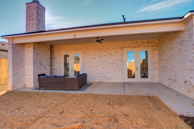 rear view of house with a patio area, ceiling fan, and french doors