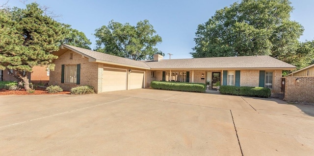 ranch-style home featuring a garage