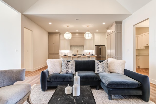 4610 138th Pl, Lubbock, TX 79424 - living area featuring light wood-style flooring, recessed lighting, and vaulted ceiling