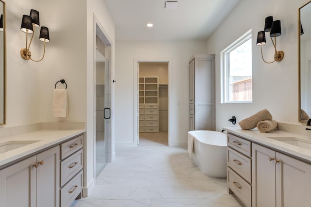 4610 138th Pl, Lubbock, TX 79424 - bathroom with two vanities, marble look tile flooring, a stall shower, a freestanding bath, and a walk in closet