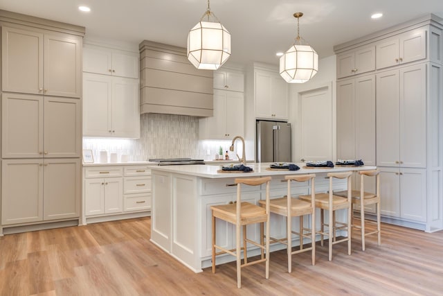 4610 138th Pl, Lubbock, TX 79424 - kitchen with high quality fridge, custom range hood, recessed lighting, light wood-style flooring, and backsplash