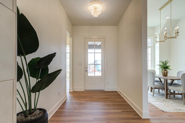 4610 138th Pl, Lubbock, TX 79424 - entrance foyer featuring a chandelier and wood finished floors
