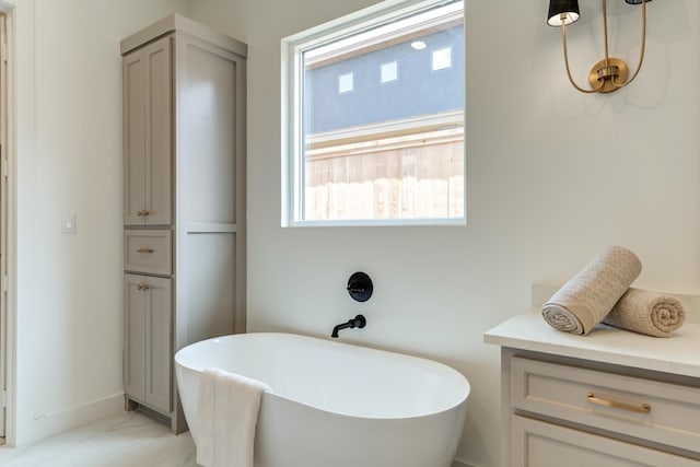 4610 138th Pl, Lubbock, TX 79424 - bathroom featuring a freestanding tub and marble finish flooring