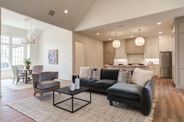 4610 138th Pl, Lubbock, TX 79424 - living area featuring a chandelier, light wood-style floors, recessed lighting, and high vaulted ceiling