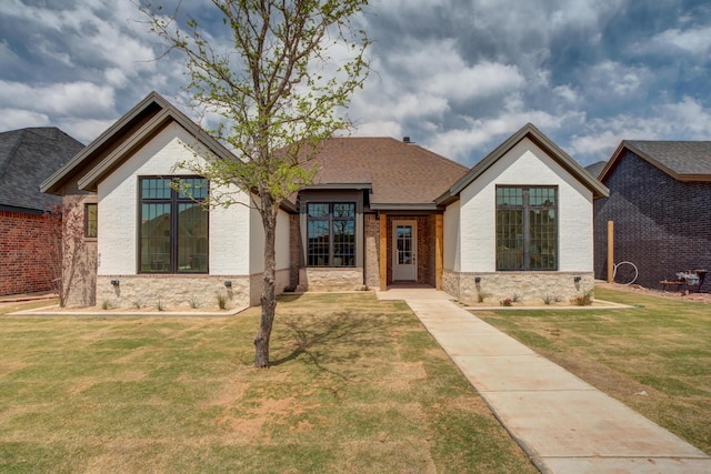 4610 138th Pl, Lubbock, TX 79424 - french country inspired facade with a front yard, brick siding, and a shingled roof