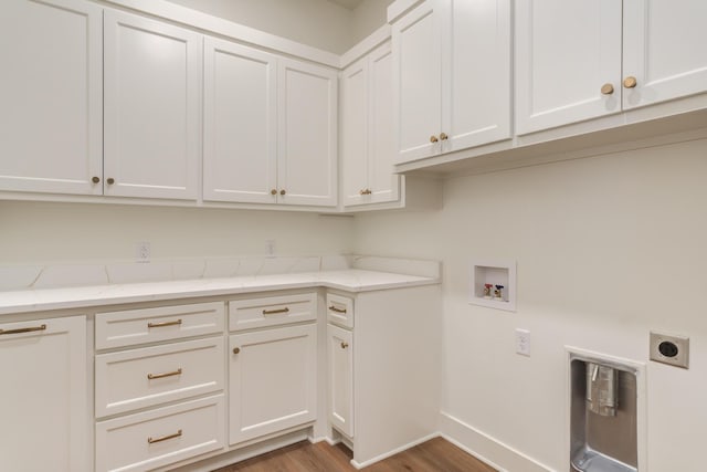 4610 138th Pl, Lubbock, TX 79424 - washroom with cabinet space, electric dryer hookup, hookup for a washing machine, and wood finished floors