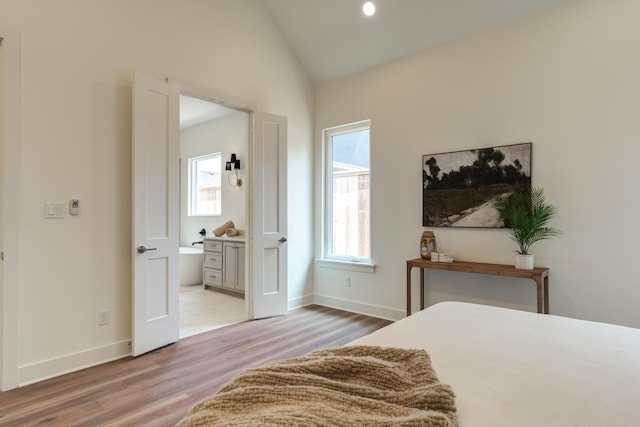4610 138th Pl, Lubbock, TX 79424 - bedroom featuring light wood-type flooring and vaulted ceiling