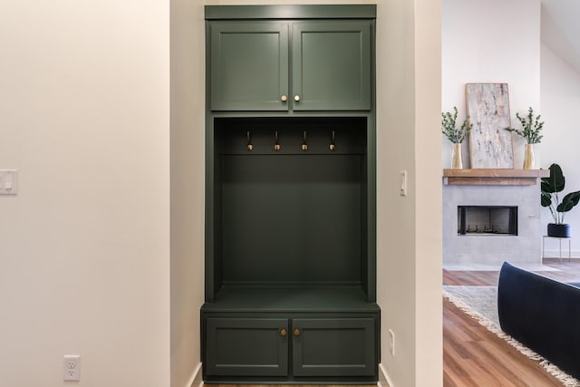 4610 138th Pl, Lubbock, TX 79424 - mudroom featuring wood finished floors and a tile fireplace
