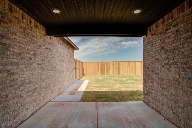 4610 138th Pl, Lubbock, TX 79424 - fenced backyard with a patio area