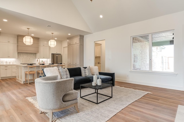 4610 138th Pl, Lubbock, TX 79424 - living room with recessed lighting, light wood-style floors, and high vaulted ceiling