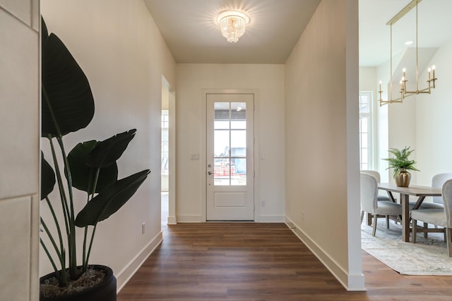 4610 138th Pl, Lubbock, TX 79424 - foyer entrance featuring a chandelier and dark wood-type flooring