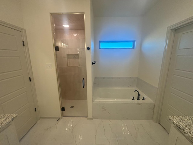 bathroom with separate shower and tub