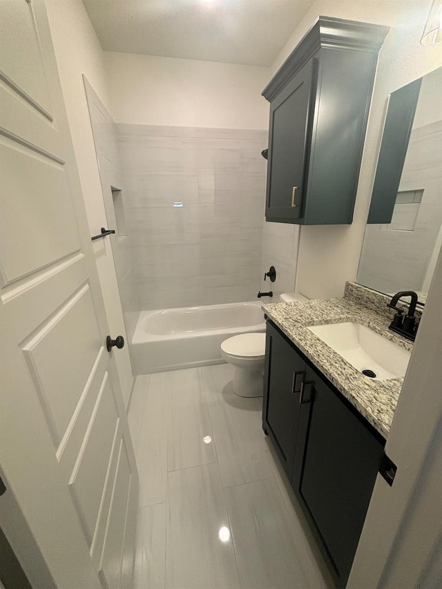 full bathroom featuring vanity, shower / tub combination, and toilet