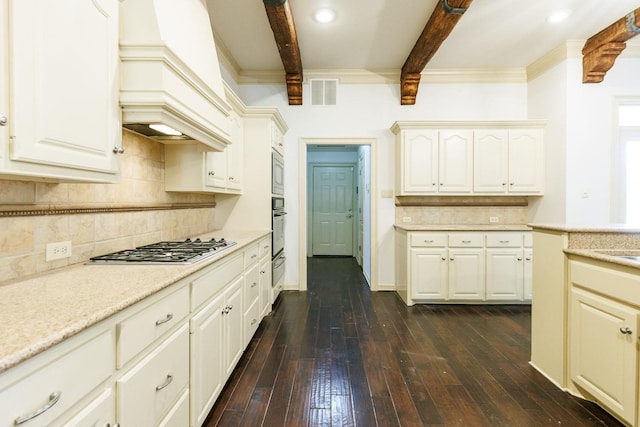 kitchen featuring appliances with stainless steel finishes, backsplash, dark hardwood / wood-style flooring, custom exhaust hood, and beam ceiling