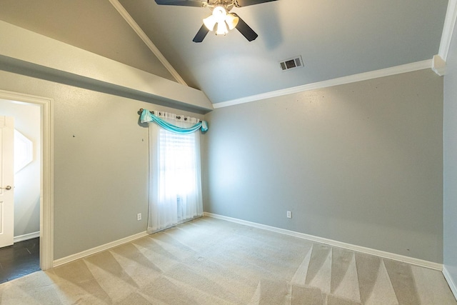 unfurnished room featuring crown molding, vaulted ceiling, ceiling fan, and carpet flooring