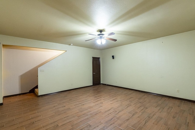 bonus room with light hardwood / wood-style flooring and ceiling fan