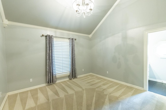 spare room with vaulted ceiling, carpet, and crown molding