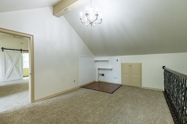 additional living space with an inviting chandelier, a barn door, carpet floors, and vaulted ceiling with beams