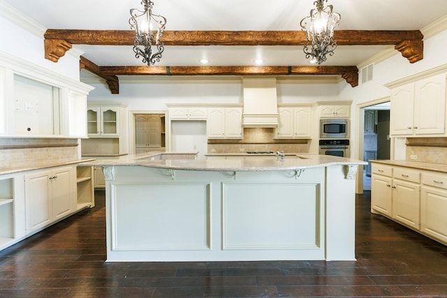 kitchen featuring pendant lighting, backsplash, custom range hood, and appliances with stainless steel finishes