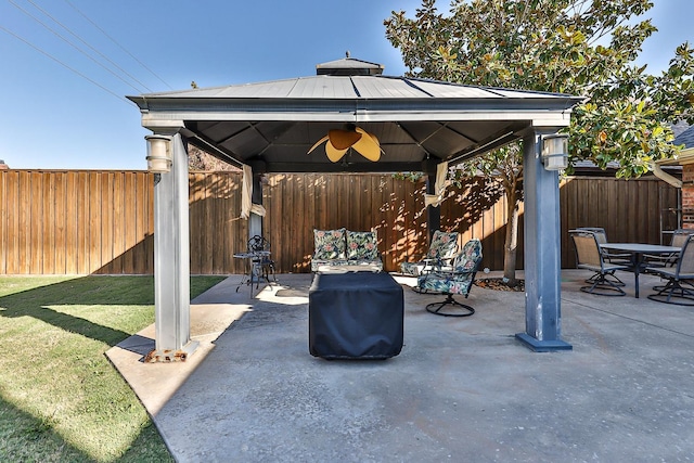 view of patio / terrace featuring a gazebo and ceiling fan