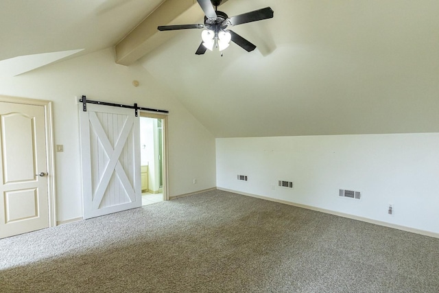 additional living space with lofted ceiling with beams, carpet floors, and ceiling fan