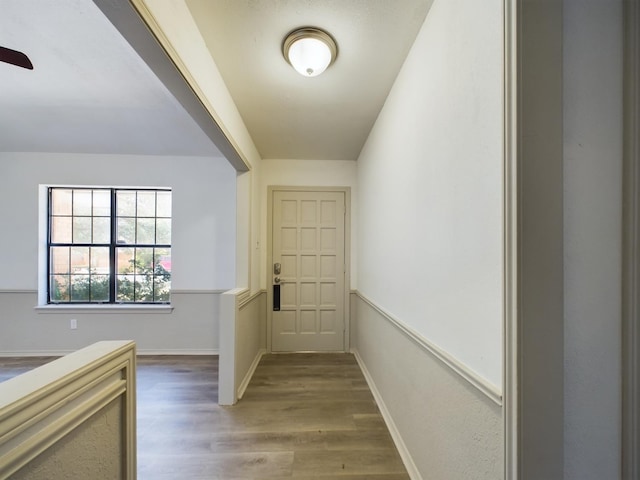 corridor featuring wood-type flooring